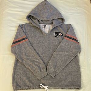 NHL Philadelphia Flyers V-neck hoodie with tie waist.